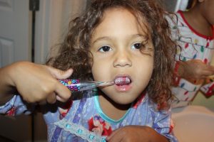 Unfortunately, many children in the United States do not practice proper dental hygiene. Teaching your young children about the importance brushing their teeth will make your life easier. 